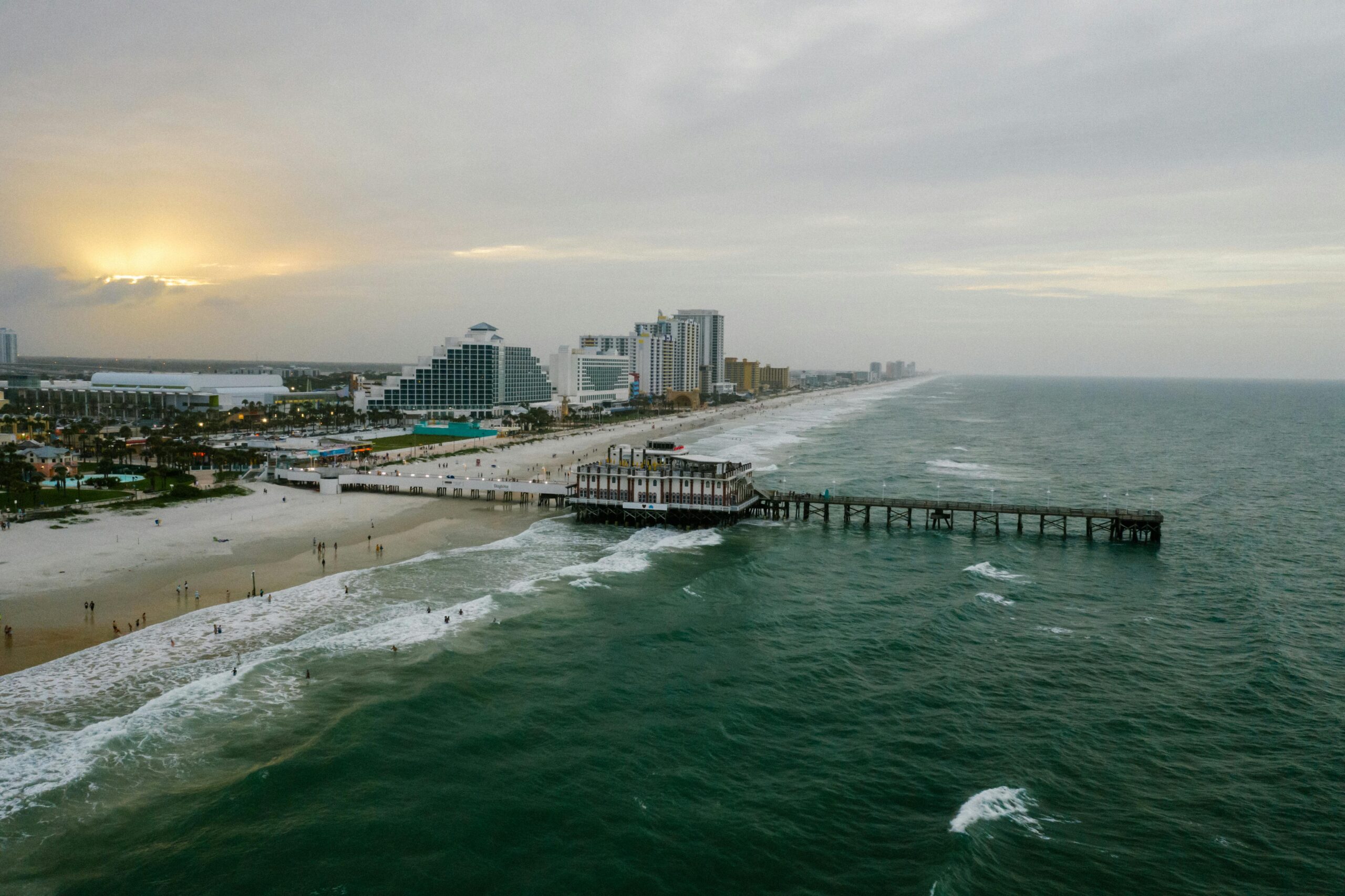 Daytona-Beach-oceanfront-and-pier-at-sunset-a-top-destination-for-private-jet-charter-flights-scaled.jpg