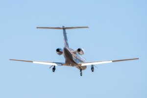 Private-jet-flying-through-blue-skies-on-a-Dallas-to-Atlanta-charter-route-scaled.jpg