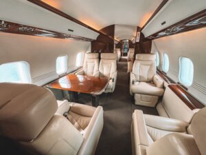 Luxury-midsize-jet-cabin-interior-available-for-private-charter-from-Minneapolis-to-Bismarck-scaled.jpg