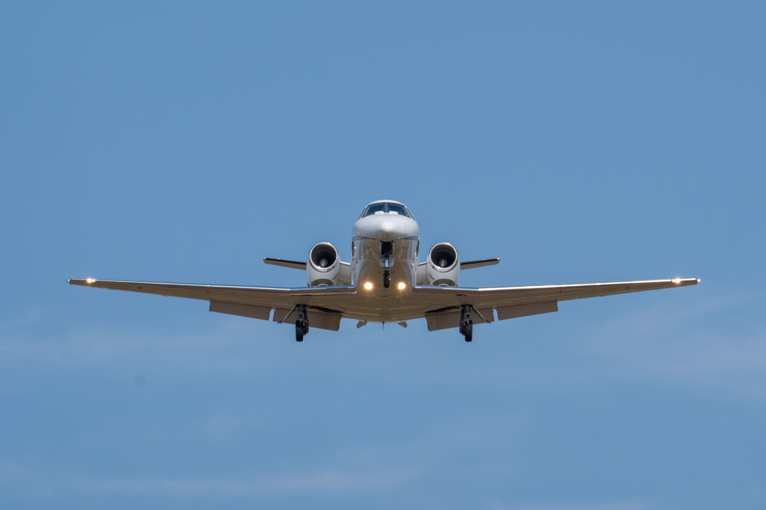 Private-jet-charter-in-the-air-descending-for-a-landing-at-Bismarck-Municipal-Airport-BIS-scaled.jpg