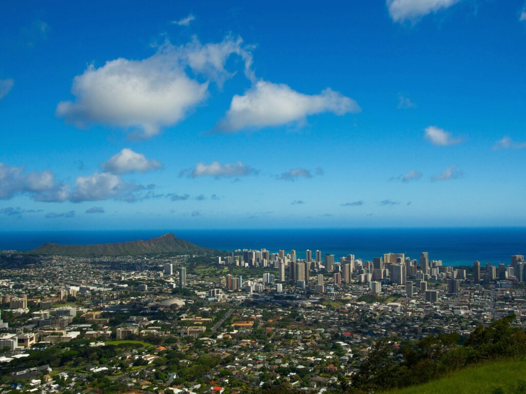 Aerial view of the Hawaiian coast and Pacific Ocean during a private jet flight to Honolulu