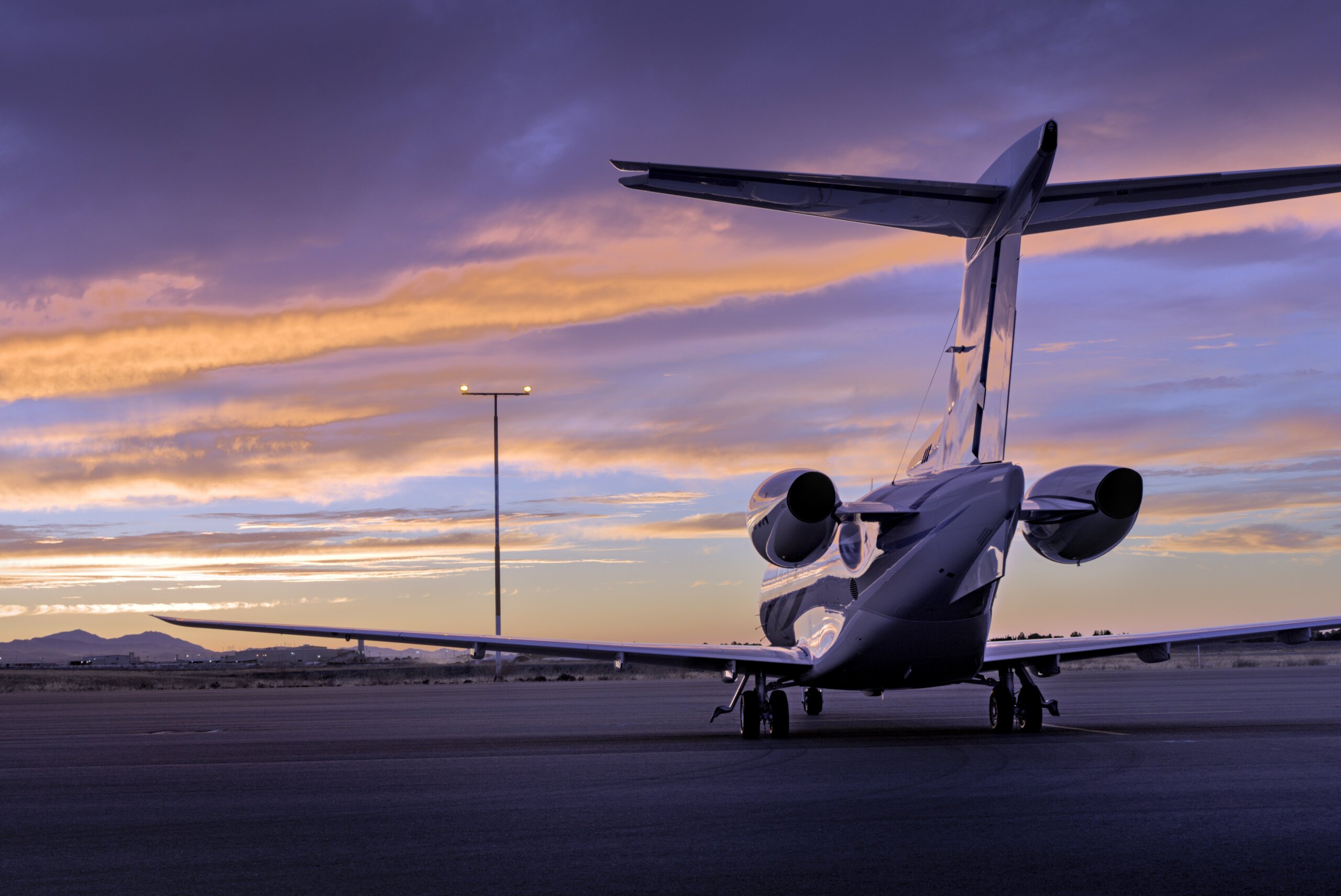 Rear view of a private jet charter from Charlotte to West Palm Beach at sunset, looking from tail to nose.
