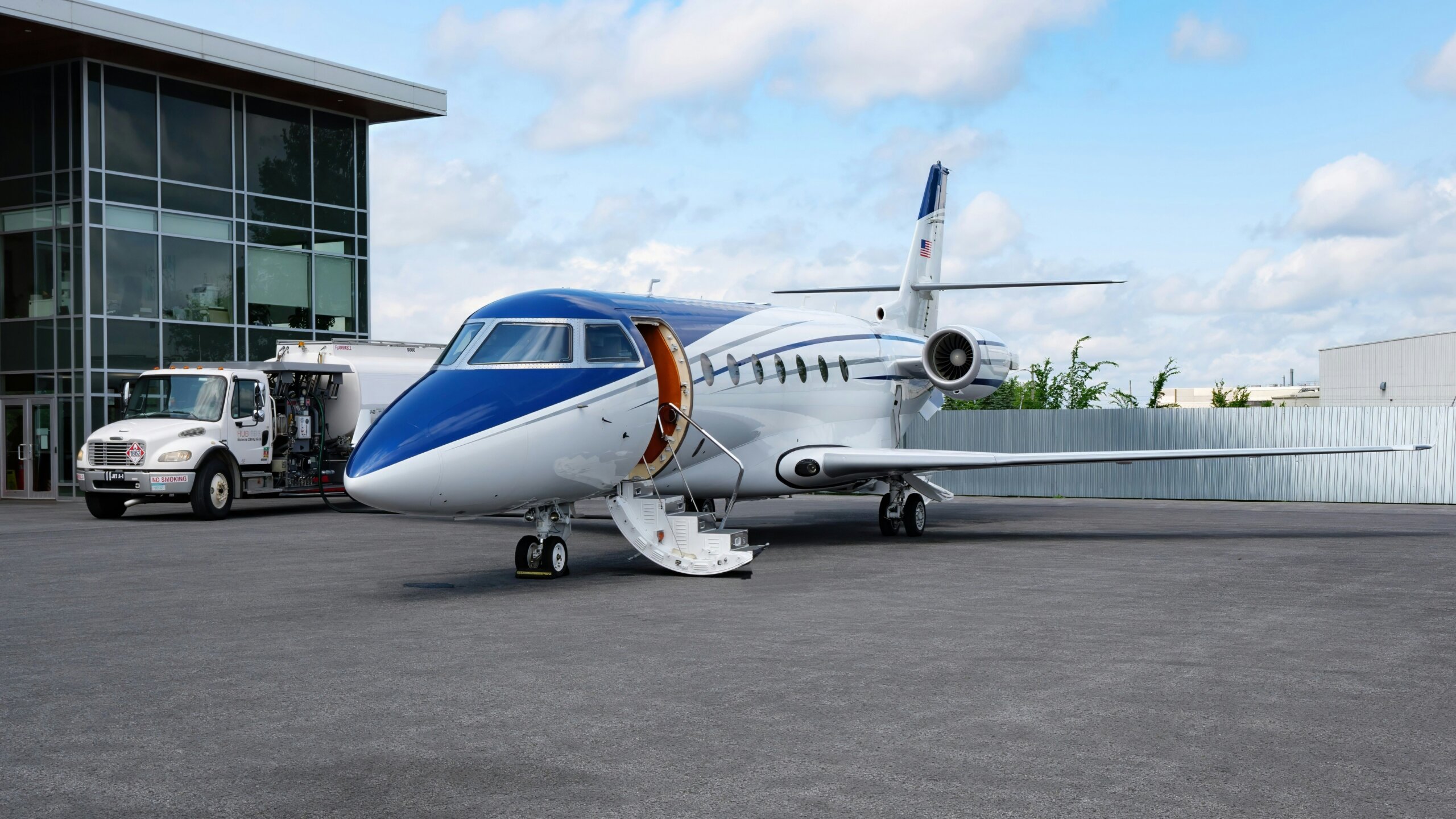 Private jet parked on the ramp with the cabin door open at Charleston International Airport in South Carolina