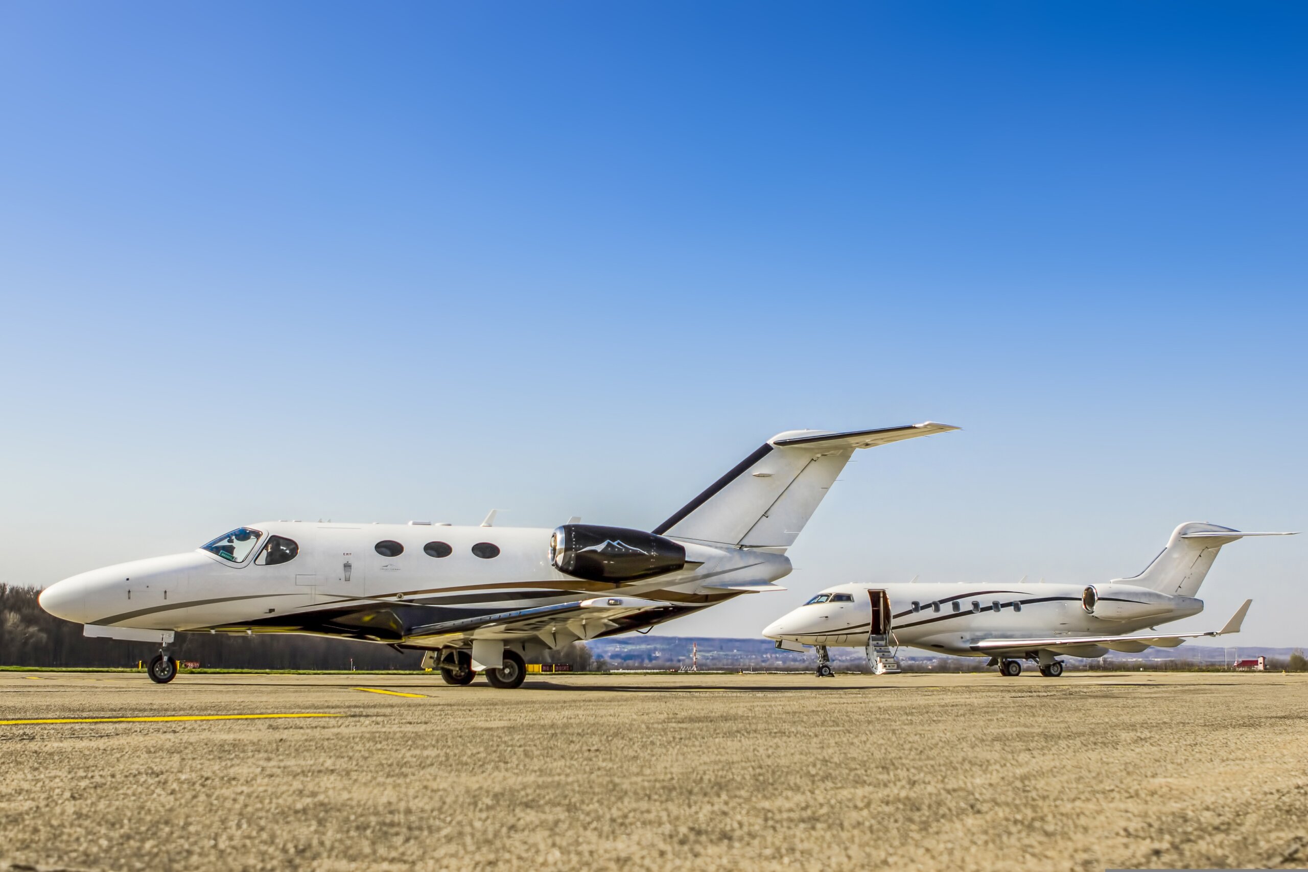 Two private jets parked on the ramp for an Orlando to Charlotte charter flight.